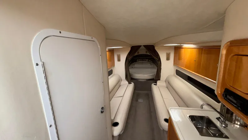 Slide: The Image of Interior of 2002 Black Thunder 460 EC boat with seating and kitchenette. - 9