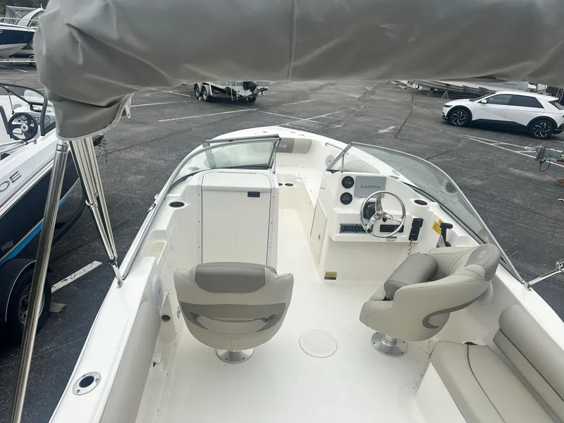 Slide: The Image of 2023 Key West 203 DFS boat interior with dual seats and steering console. - 15