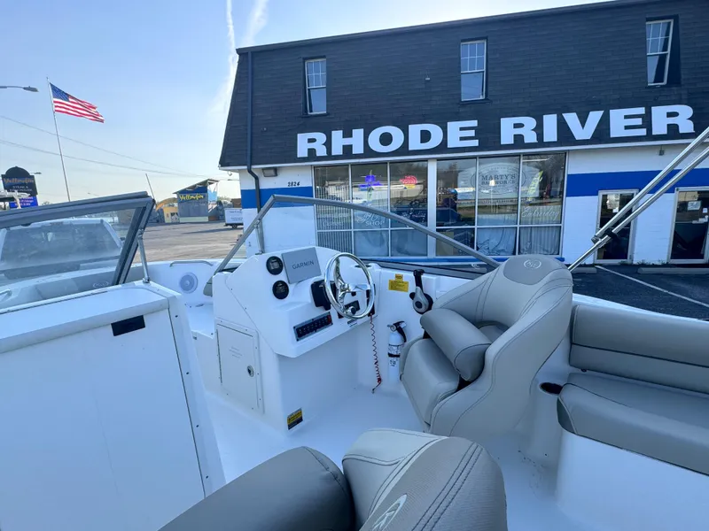 Slide: The Image of 2023 Key West 203 DFS boat interior at Rhode River dealership with American flag. - 23