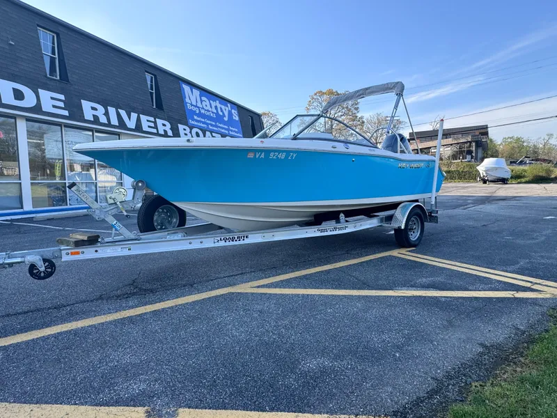 Slide: The Image of 2023 Key West 203 DFS boat on trailer outside dealership. - 4