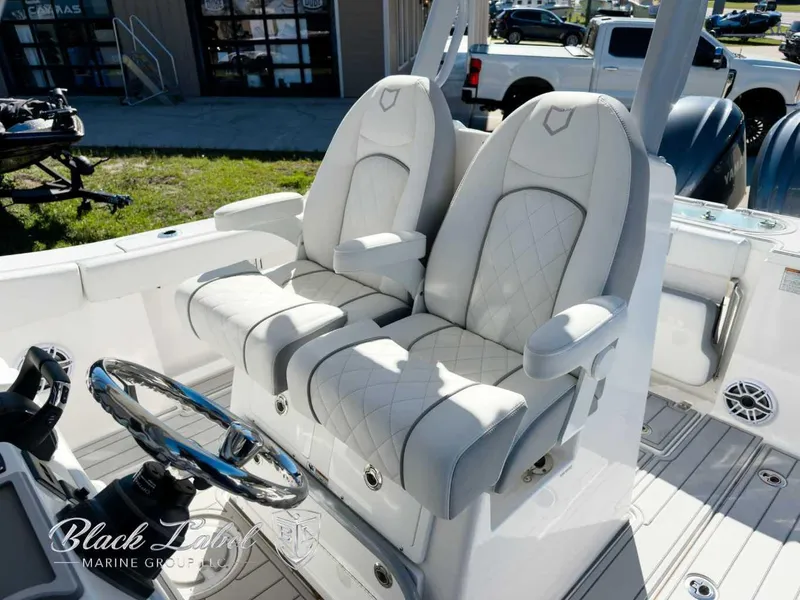 Slide: The Image of Luxury seating on 2025 Sea Fox 288 Commander boat, featuring plush, diamond-stitched upholstery. - 11