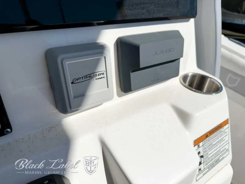 Slide: The Image of 2025 Sea Fox 288 Commander dashboard with Optimus EPS and JL Audio controls. - 15
