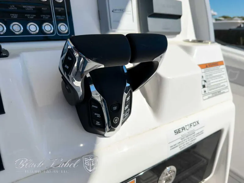 Slide: The Image of Close-up of 2025 Sea Fox 288 Commander boat controls and dashboard. - 16