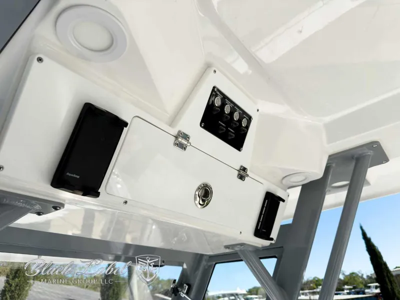 Slide: The Image of 2025 Sea Fox 288 Commander boat interior with storage compartment and control panel. - 18