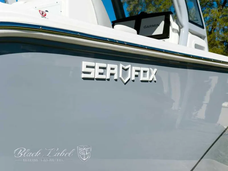 Slide: The Image of 2025 Sea Fox 288 Commander boat with logo and Garmin equipment visible. - 2