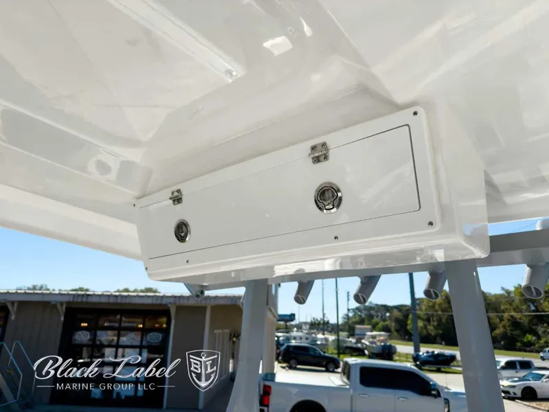 Slide: The Image of 2025 Sea Fox 288 Commander boat storage compartment, Black Label Marine Group branding. - 20