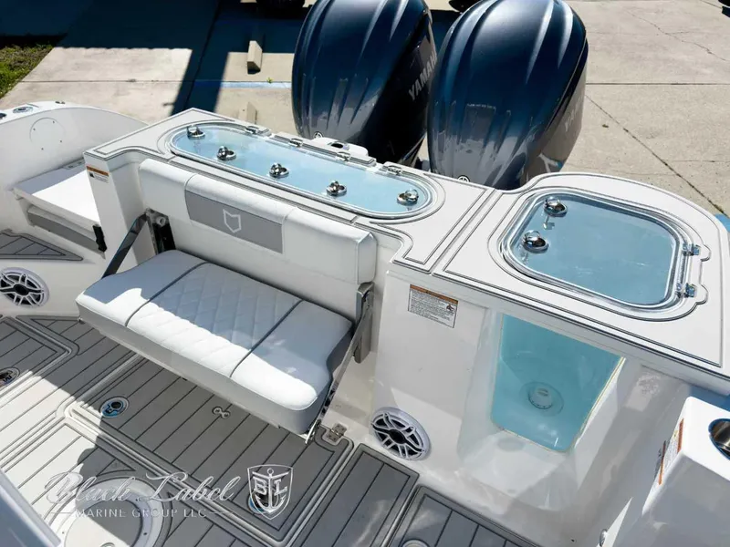 Slide: The Image of 2025 Sea Fox 288 Commander boat interior with seating and dual Yamaha engines. - 23