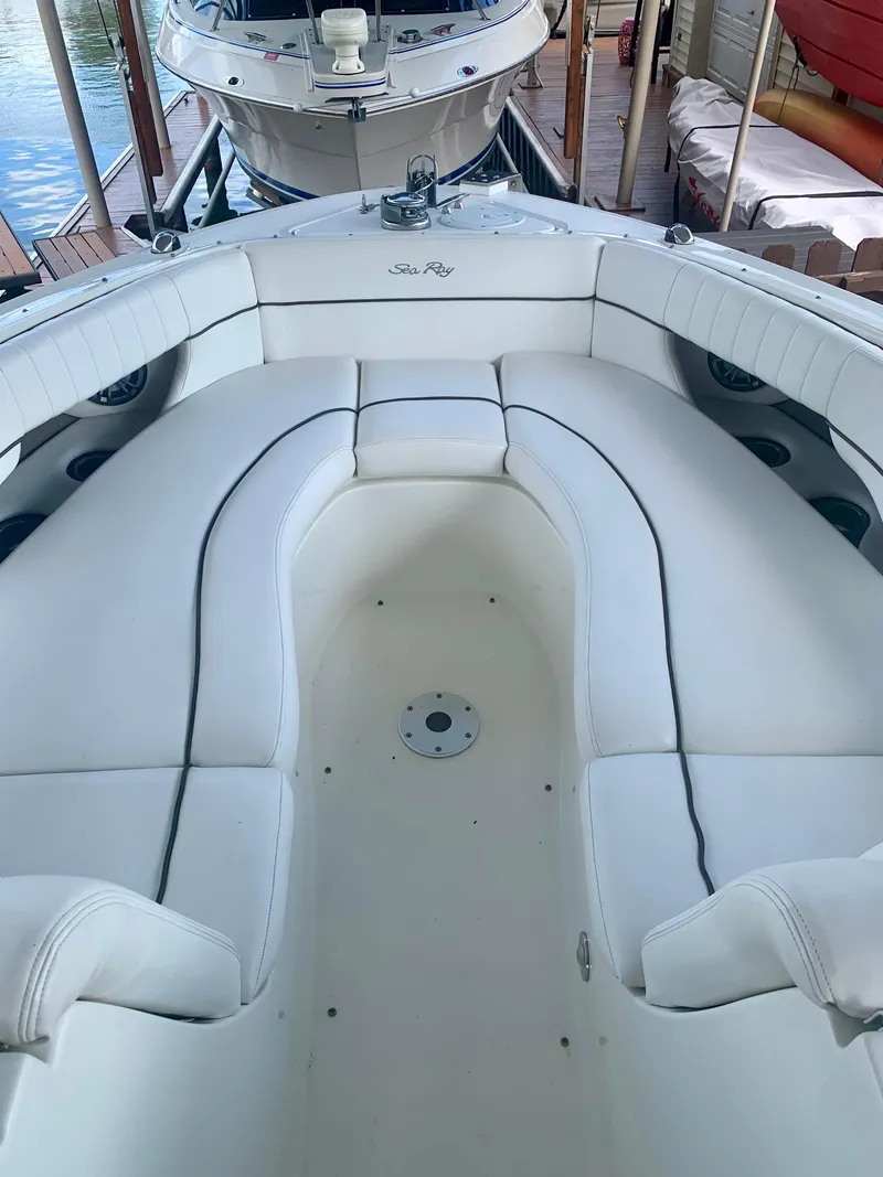 Slide: The Image of 2009 Sea Ray 300 SLX boat with spacious white seating and sleek design. - 11