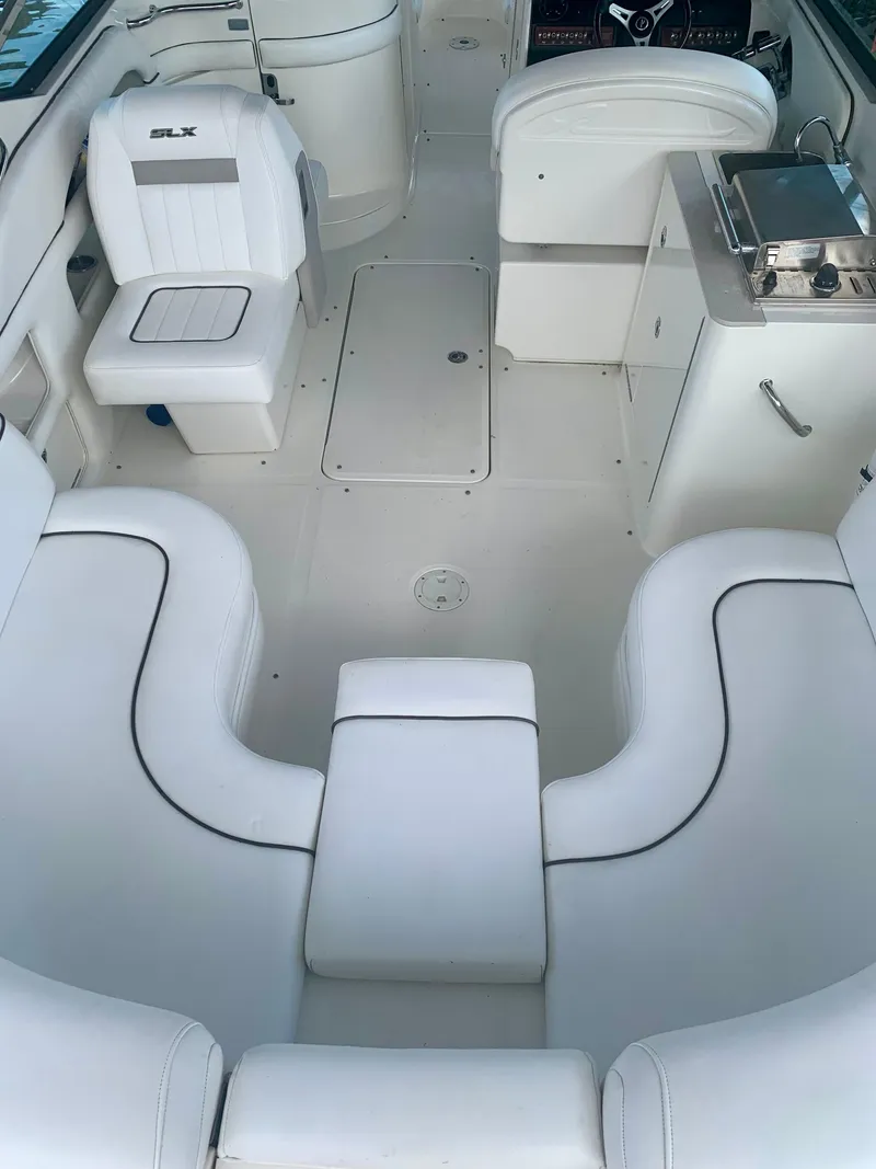 Slide: The Image of 2009 Sea Ray 300 SLX boat interior with white seating and sleek design. - 8