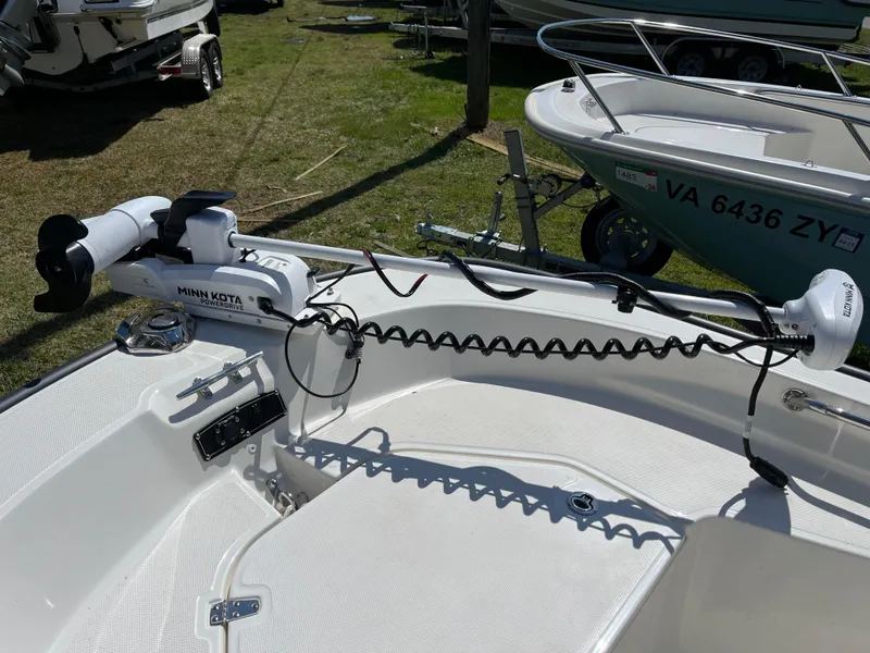 Slide: The Image of 2024 Boston Whaler 150 Montauk boat with Minn Kota trolling motor on deck. - 3