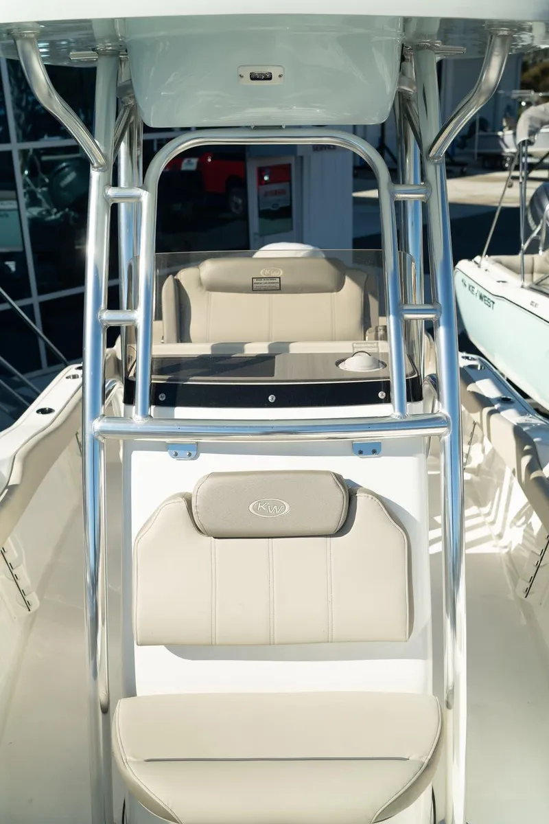 Slide: The Image of 2024 Key West 219 FS boat interior with seating and console. - 4