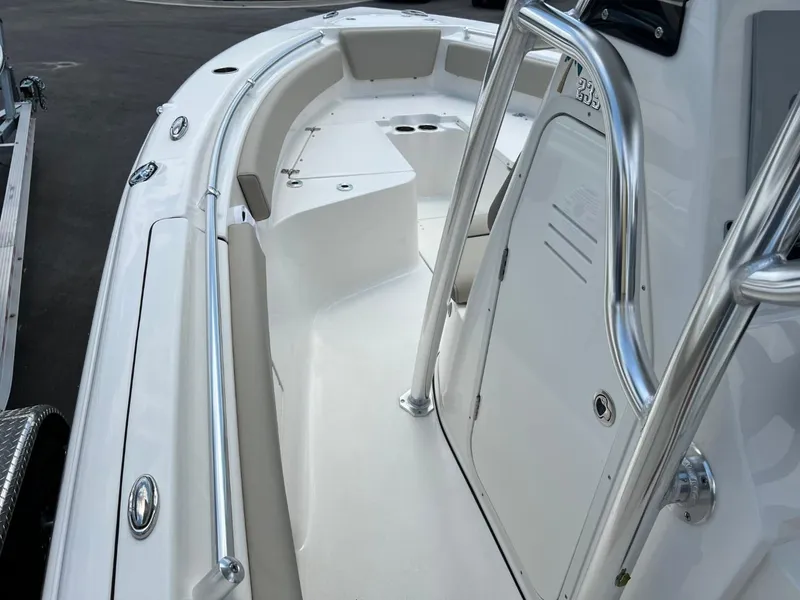 Slide: The Image of 2024 Key West 239 FS boat interior with sleek white design and stainless steel railings. - 15