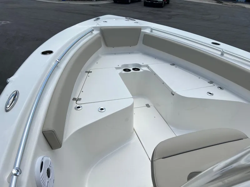 Slide: The Image of 2024 Key West 239 FS boat interior with seating and storage compartments. - 16