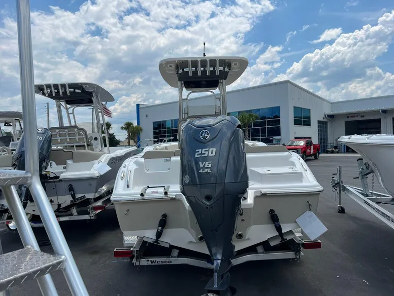Slide: The Image of 2024 Key West 239 FS boat with Yamaha 250 V6 engine, displayed outdoors under a cloudy sky. - 3