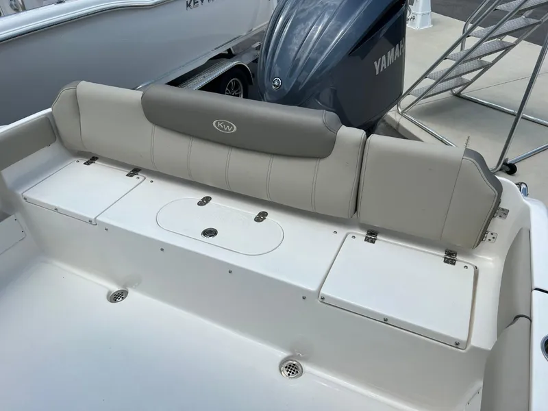 Slide: The Image of 2024 Key West 239 FS boat with Yamaha engine, featuring comfortable seating and storage compartments. - 4