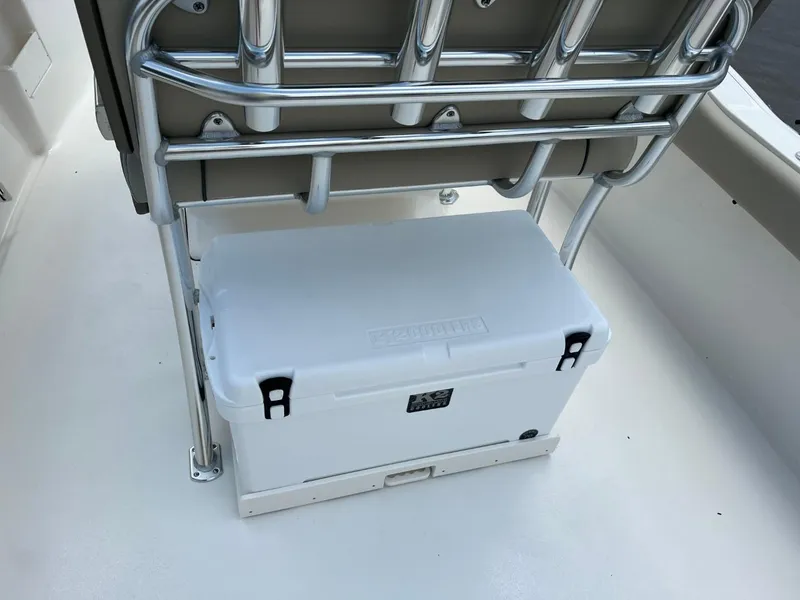 Slide: The Image of 2024 Key West 239 FS boat with cooler under metal seat frame. - 5