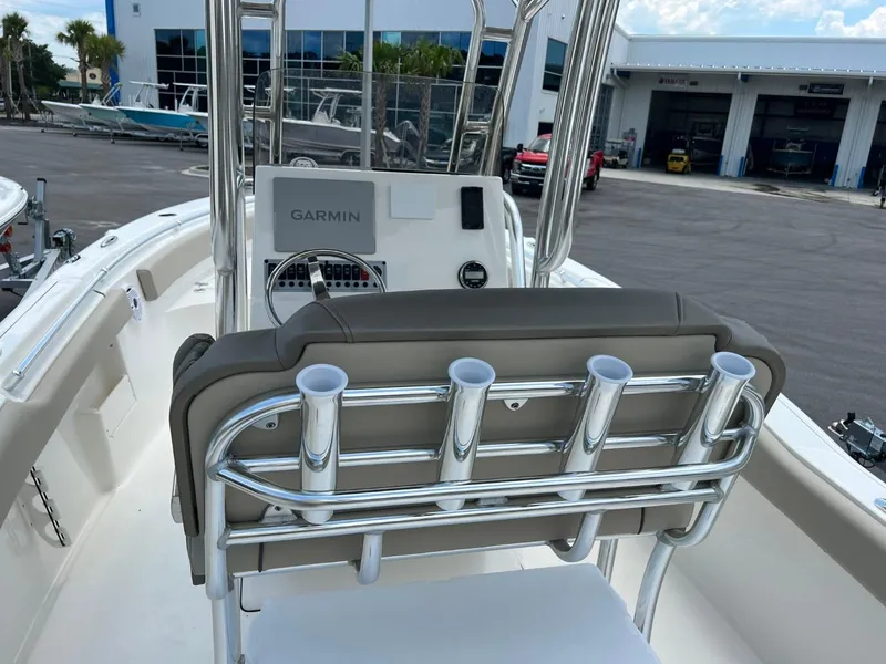 Slide: The Image of 2024 Key West 239 FS boat interior with Garmin navigation system and rod holders. - 6