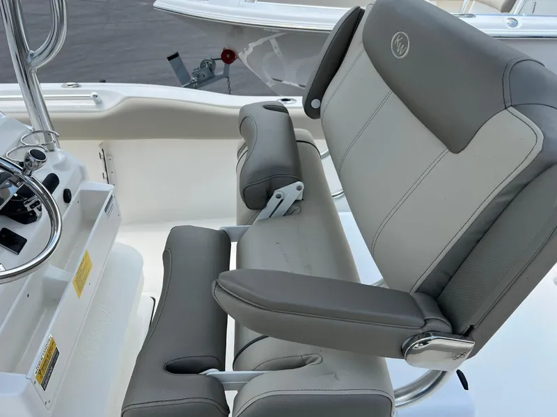 Slide: The Image of 2024 Key West 239 FS boat seat with gray and white upholstery. - 9