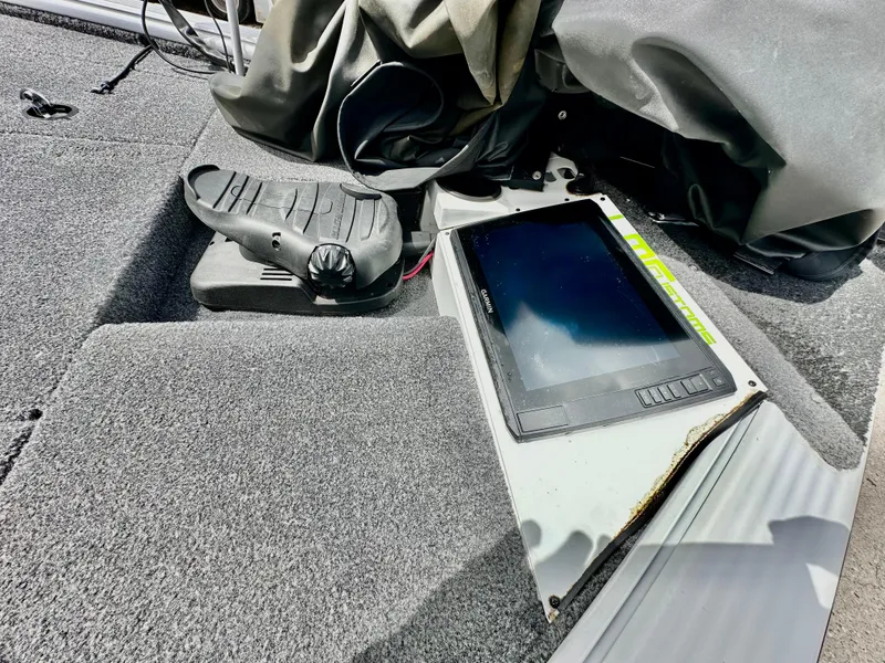 Slide: The Image of 2018 Lund 1875 Pro-V Bass boat with electronic display and foot pedal on deck. - 11