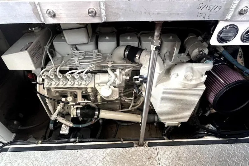 Slide: The Image of Engine compartment of a 2000 Carver 396 Motor Yacht, showcasing mechanical components. - 30