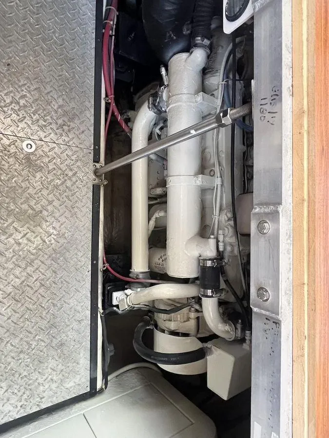 Slide: The Image of Engine compartment of a 2000 Carver 396 Motor Yacht, showcasing mechanical components. - 32