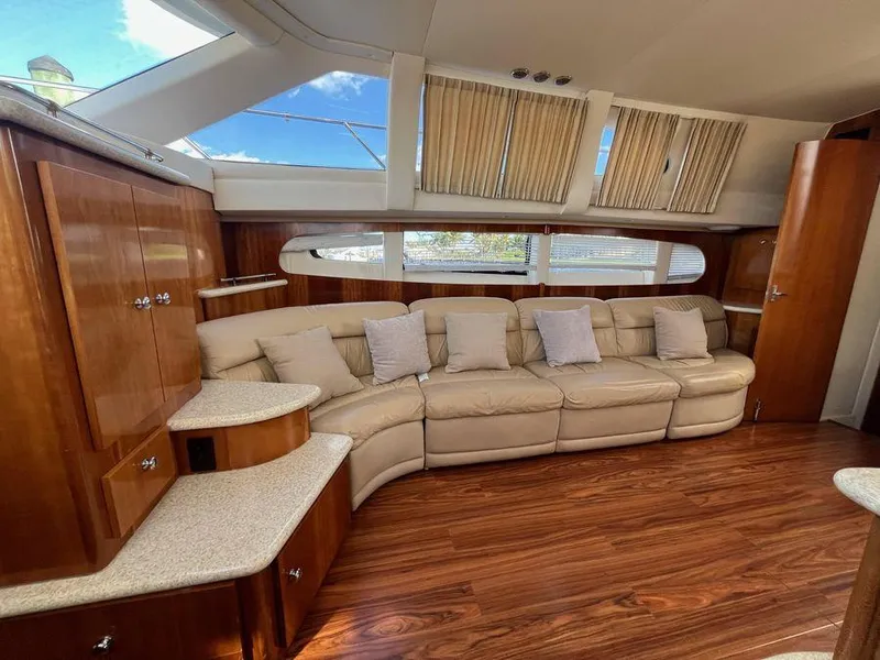 Slide: The Image of Luxurious interior of 2000 Carver 396 Motor Yacht with plush seating and elegant wood finishes. - 20
