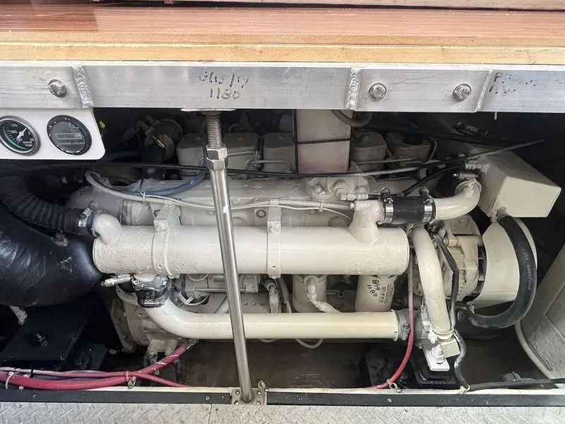 Slide: The Image of Engine compartment of a 2000 Carver 396 Motor Yacht, showcasing mechanical components and gauges. - 31