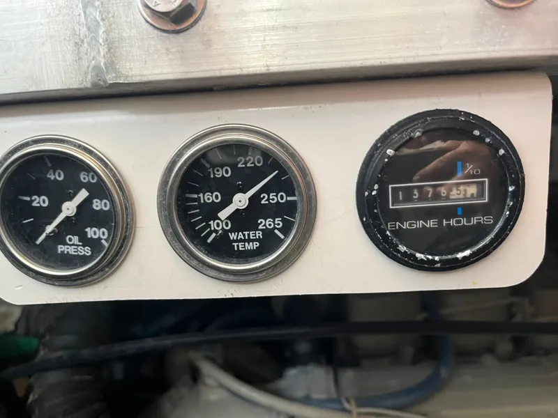 Slide: The Image of Gauges on a 2000 Carver 396 Motor Yacht showing oil pressure, water temperature, and engine hours. - 35