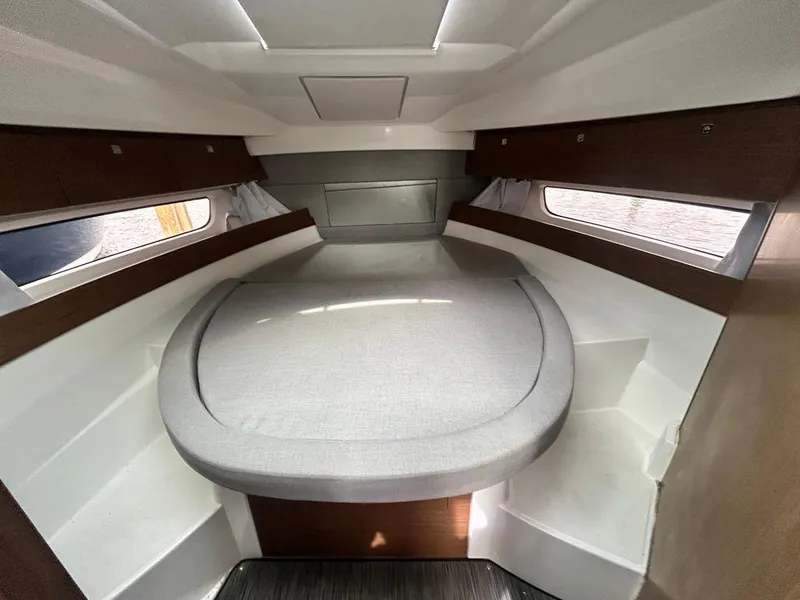 Slide: The Image of 2019 Jeanneau NC 895 cabin interior with cozy bed and modern design. - 12