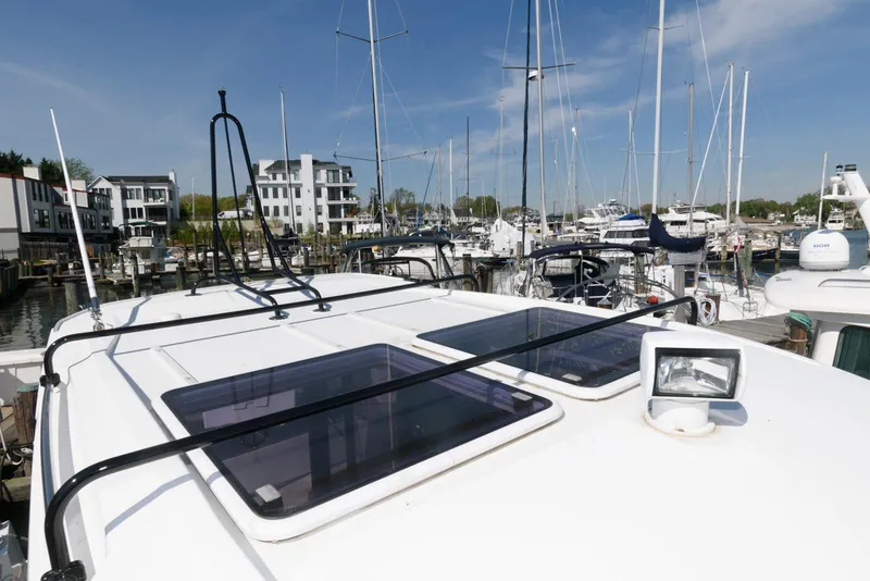Slide: The Image of 2019 Jeanneau NC 895 boat docked in a marina with clear blue skies. - 20