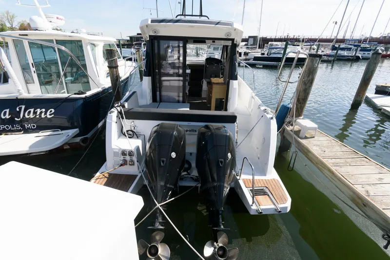 Slide: The Image of 2019 Jeanneau NC 895 boat docked with twin outboard engines. - 4