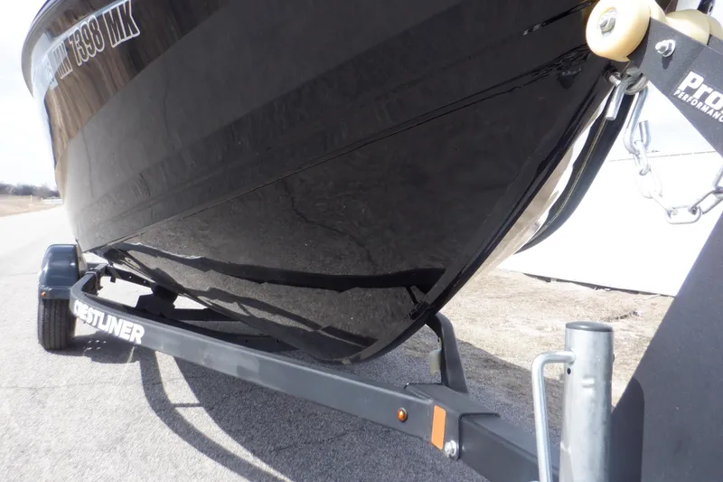 Slide: The Image of 2023 Crestliner 1650 FISH HAWK SE WT boat on trailer, side view. - 10