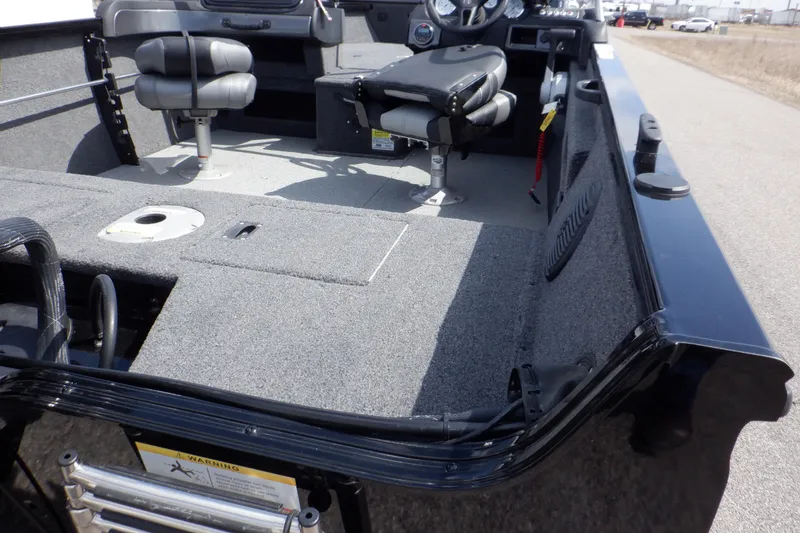 Slide: The Image of 2023 Crestliner 1650 Fish Hawk SE WT boat interior with seating and deck features. - 14