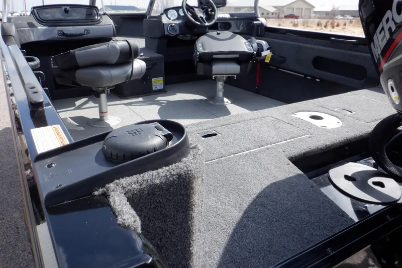 Slide: The Image of 2023 Crestliner 1650 Fish Hawk SE WT interior with seating and fishing deck. - 15