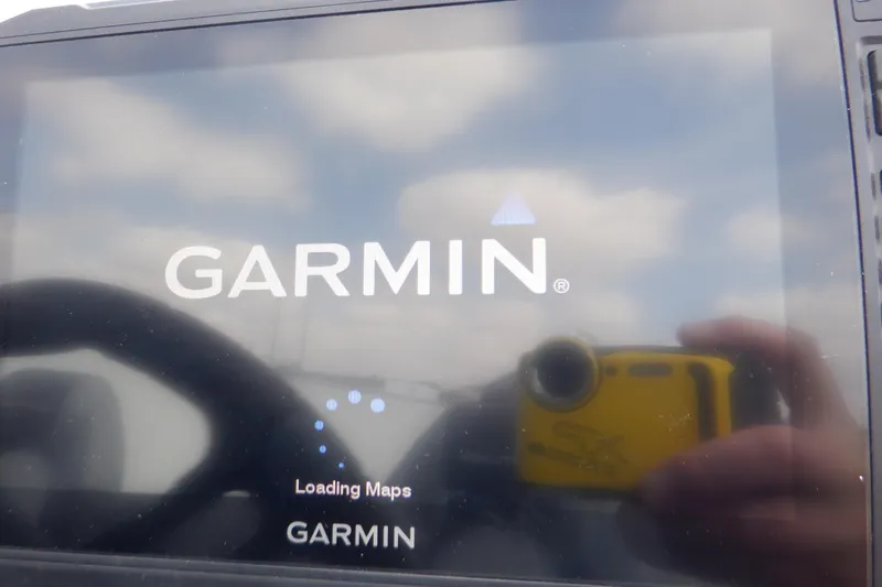 Slide: The Image of Garmin GPS loading maps on Crestliner 1650 Fish Hawk SE WT, 2023 model. - 16