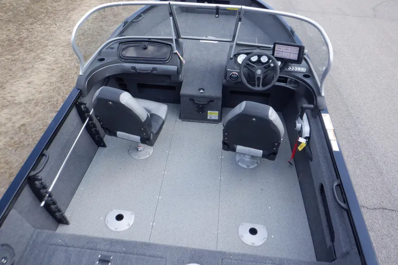 Slide: The Image of 2023 Crestliner 1650 Fish Hawk SE WT boat interior with dual seats and steering console. - 17