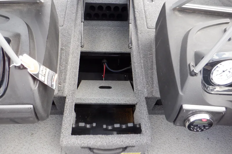 Slide: The Image of 2023 Crestliner 1650 Fish Hawk SE WT boat interior with storage compartments and control panel. - 21