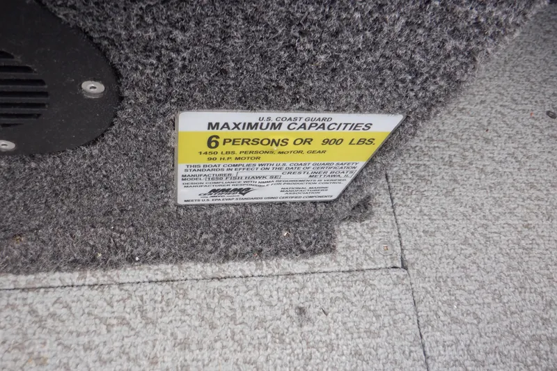 Slide: The Image of 2023 Crestliner 1650 Fish Hawk SE WT capacity label, 6 persons or 900 lbs. - 23