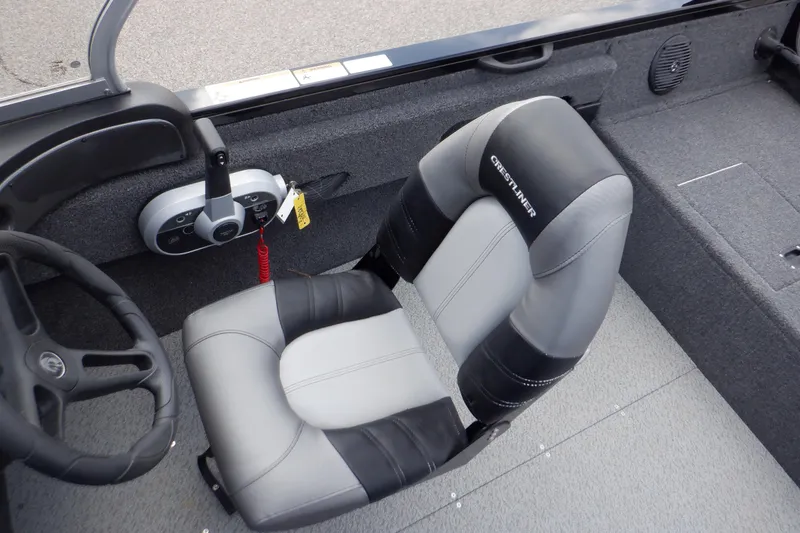 Slide: The Image of 2023 Crestliner 1650 Fish Hawk SE WT boat interior with steering wheel and seat. - 24