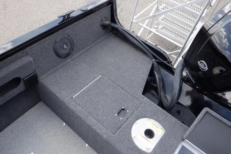 Slide: The Image of 2023 Crestliner 1650 Fish Hawk SE WT boat interior with speaker and storage compartment. - 29