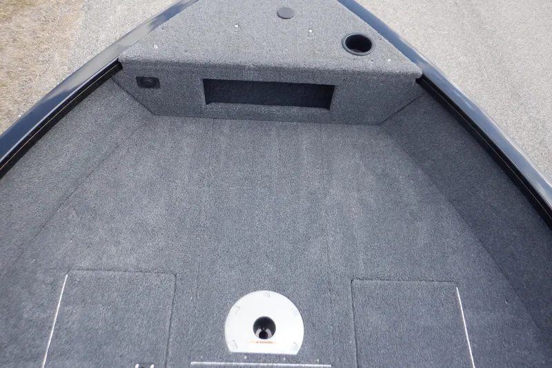 Slide: The Image of 2023 Crestliner 1650 Fish Hawk SE WT boat interior with gray carpeted deck. - 32