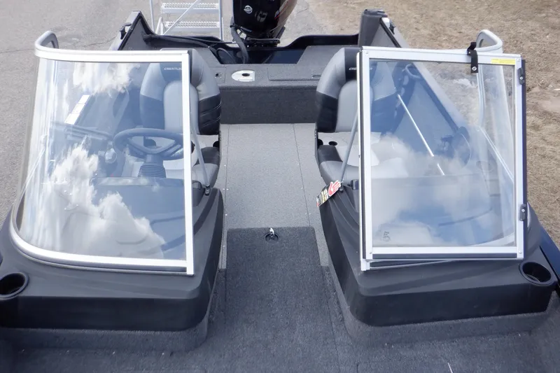 Slide: The Image of 2023 Crestliner 1650 Fish Hawk SE WT boat interior with dual windshields and seating. - 35
