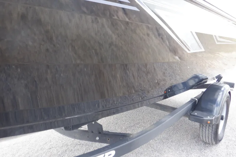 Slide: The Image of 2023 Crestliner 1650 Fish Hawk SE WT boat on trailer, side view. - 37