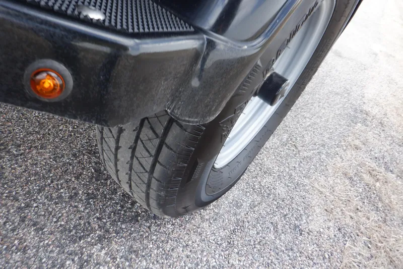 Slide: The Image of Close-up of a 2023 Crestliner 1650 Fish Hawk SE WT trailer tire on asphalt. - 38