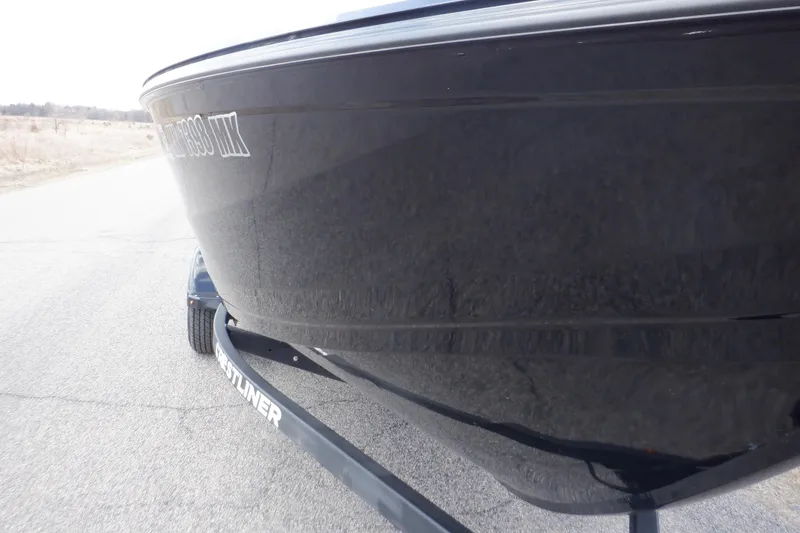 Slide: The Image of 2023 Crestliner 1650 Fish Hawk SE WT boat on trailer, side view. - 39