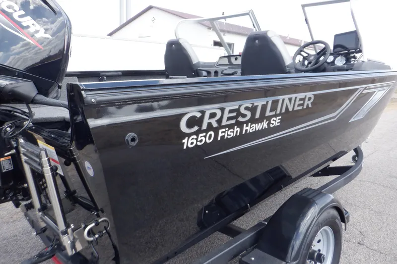 Slide: The Image of 2023 Crestliner 1650 Fish Hawk SE WT boat on trailer, side view. - 41