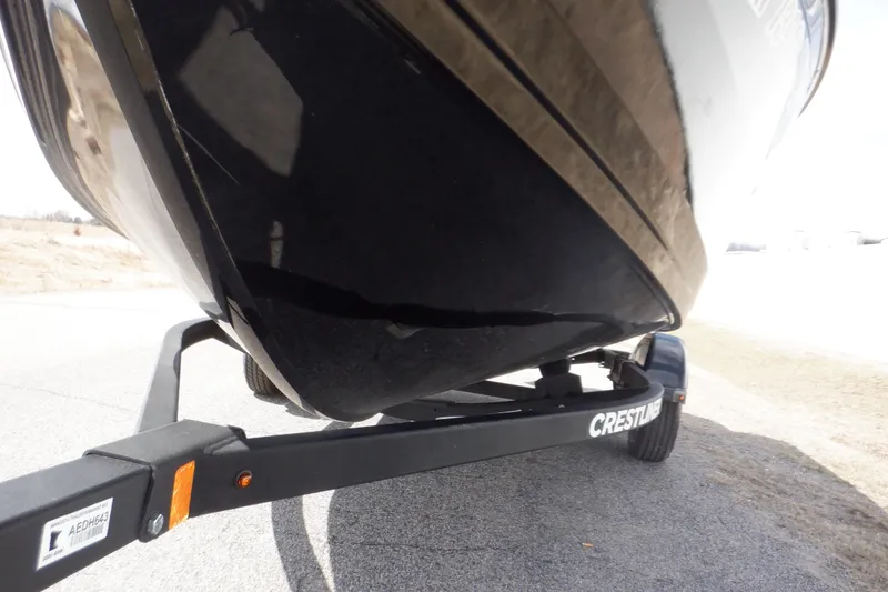 Slide: The Image of 2023 Crestliner 1650 Fish Hawk SE WT boat on trailer, close-up view. - 9