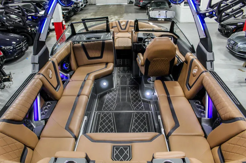 Slide: The Image of Luxurious interior of 2021 Tigé 25ZX boat with tan seating and modern design. - 10