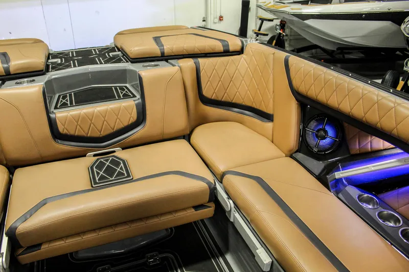 Slide: The Image of 2021 Tigé 25ZX boat interior with luxurious tan leather seating and modern design elements. - 20