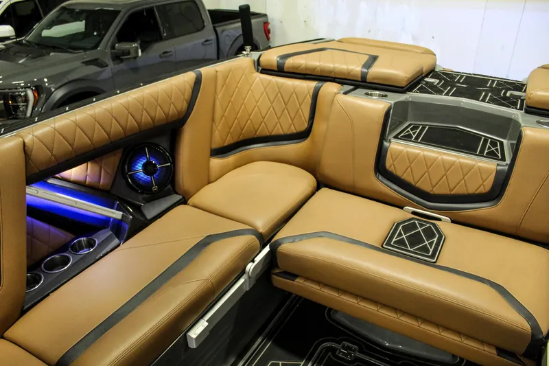 Slide: The Image of Luxurious interior of 2021 Tigé 25ZX boat with tan leather seating and modern design. - 23